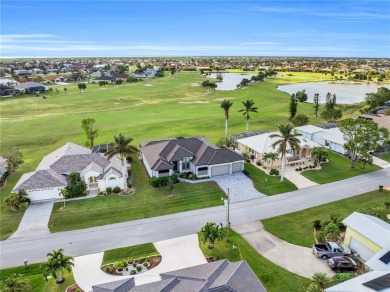 This exceptional residence, situated on the 13th hole of Twin on Twin Isles Country Club in Florida - for sale on GolfHomes.com, golf home, golf lot