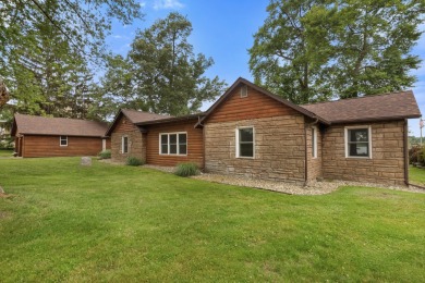 Rare opportunity on all-sports Goguac Lake! This 3-bedroom, 2 on Battle Creek Country Club in Michigan - for sale on GolfHomes.com, golf home, golf lot