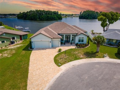 Experience luxurious living with this custom-built lake front on North Lakes Golf Course in Florida - for sale on GolfHomes.com, golf home, golf lot