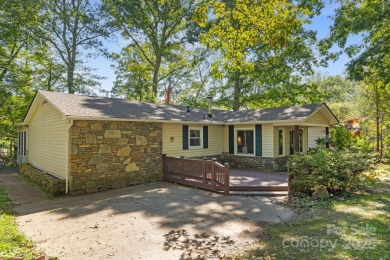 Where charm meets ideal location, this 3/2 with bonus rooms on Black Mountain Golf Course in North Carolina - for sale on GolfHomes.com, golf home, golf lot
