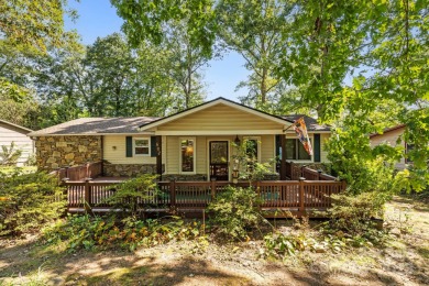 Where charm meets ideal location, this 3/2 with bonus rooms on Black Mountain Golf Course in North Carolina - for sale on GolfHomes.com, golf home, golf lot