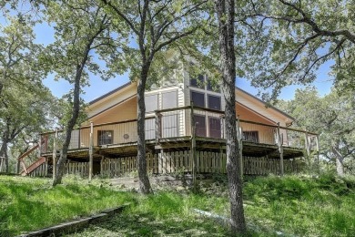Discover the charm of this unique Ralph Lauren Cottage-inspired on Nocona Hills Golf Course in Texas - for sale on GolfHomes.com, golf home, golf lot