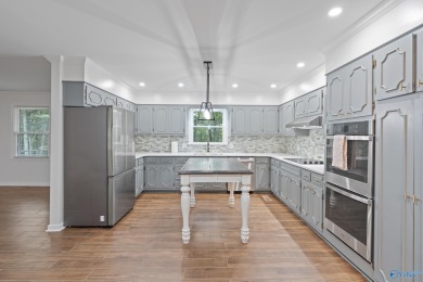 ASSUMABLE 5.25% VA LOAN! Stunning fully remodeled home for sale on Burningtree Country Club in Alabama - for sale on GolfHomes.com, golf home, golf lot