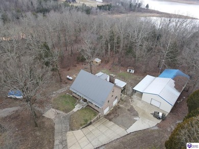 Lakefront Home with 2 Docks on 3 lots totaling 3.43 acres. Docks on Rough River Dam State Resort Park Golf Course in Kentucky - for sale on GolfHomes.com, golf home, golf lot