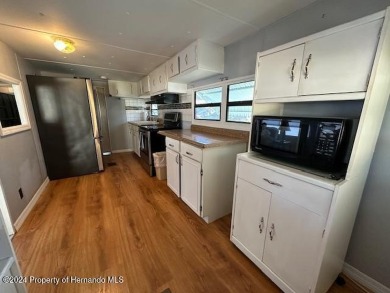 NO LOT RENT, it is a deeded lot, 2 bedrooms 1-1/2 Baths on Tooke on Glen Lakes Country Club in Florida - for sale on GolfHomes.com, golf home, golf lot