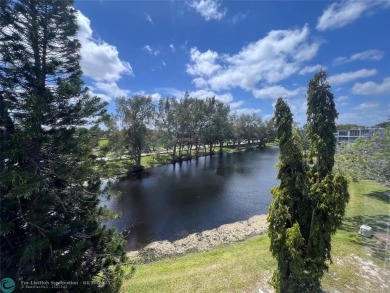 LOCATION! LOCATION!! DIRECTLY AROSS FROM THE CLUBHOUSE! COME AND on Hillsboro Pines Golf in Florida - for sale on GolfHomes.com, golf home, golf lot