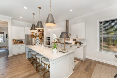 This stunning Braxton floorplan--one of the most sought-after on Hasentree Club in North Carolina - for sale on GolfHomes.com, golf home, golf lot