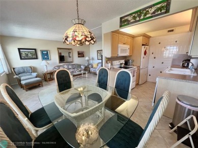 LOCATION! LOCATION!! DIRECTLY AROSS FROM THE CLUBHOUSE! COME AND on Hillsboro Pines Golf in Florida - for sale on GolfHomes.com, golf home, golf lot