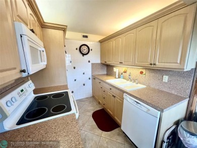 LOCATION! LOCATION!! DIRECTLY AROSS FROM THE CLUBHOUSE! COME AND on Hillsboro Pines Golf in Florida - for sale on GolfHomes.com, golf home, golf lot