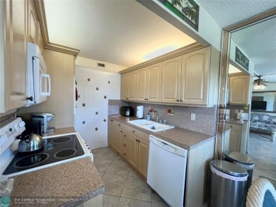 LOCATION! LOCATION!! DIRECTLY AROSS FROM THE CLUBHOUSE! COME AND on Hillsboro Pines Golf in Florida - for sale on GolfHomes.com, golf home, golf lot
