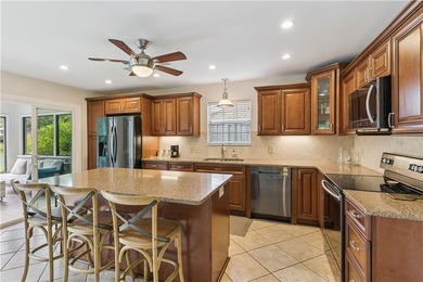 This South-end bungalow offers beautiful views of Lake Worth in on Sea Island Golf Club in Georgia - for sale on GolfHomes.com, golf home, golf lot