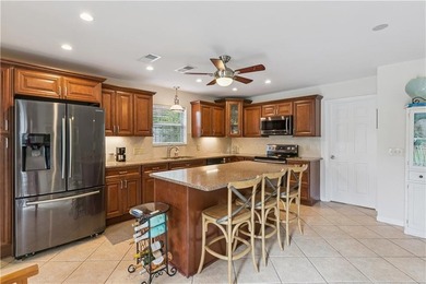 This South-end bungalow offers beautiful views of Lake Worth in on Sea Island Golf Club in Georgia - for sale on GolfHomes.com, golf home, golf lot