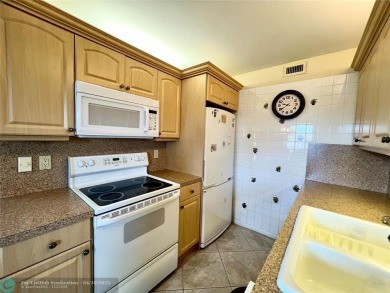 LOCATION! LOCATION!! DIRECTLY AROSS FROM THE CLUBHOUSE! COME AND on Hillsboro Pines Golf in Florida - for sale on GolfHomes.com, golf home, golf lot