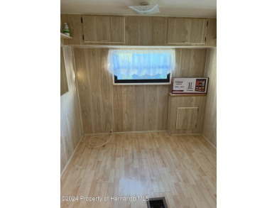 NO LOT RENT, it is a deeded lot, 2 bedrooms 1-1/2 Baths on Tooke on Glen Lakes Country Club in Florida - for sale on GolfHomes.com, golf home, golf lot