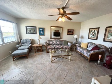 LOCATION! LOCATION!! DIRECTLY AROSS FROM THE CLUBHOUSE! COME AND on Hillsboro Pines Golf in Florida - for sale on GolfHomes.com, golf home, golf lot