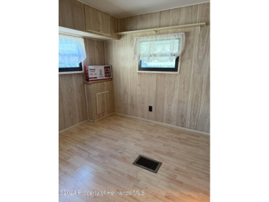 NO LOT RENT, it is a deeded lot, 2 bedrooms 1-1/2 Baths on Tooke on Glen Lakes Country Club in Florida - for sale on GolfHomes.com, golf home, golf lot