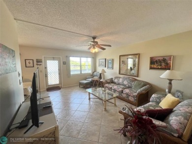 LOCATION! LOCATION!! DIRECTLY AROSS FROM THE CLUBHOUSE! COME AND on Hillsboro Pines Golf in Florida - for sale on GolfHomes.com, golf home, golf lot
