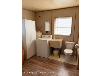 NO LOT RENT, it is a deeded lot, 2 bedrooms 1-1/2 Baths on Tooke on Glen Lakes Country Club in Florida - for sale on GolfHomes.com, golf home, golf lot
