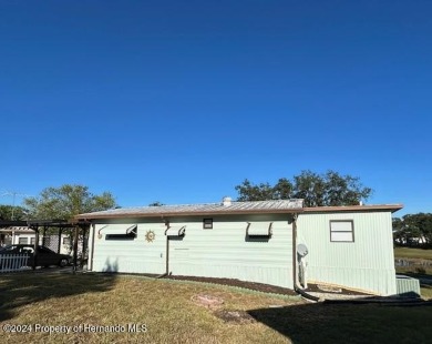 NO LOT RENT, it is a deeded lot, 2 bedrooms 1-1/2 Baths on Tooke on Glen Lakes Country Club in Florida - for sale on GolfHomes.com, golf home, golf lot