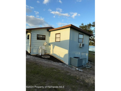 NO LOT RENT, it is a deeded lot, 2 bedrooms 1-1/2 Baths on Tooke on Glen Lakes Country Club in Florida - for sale on GolfHomes.com, golf home, golf lot