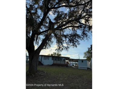 NO LOT RENT, it is a deeded lot, 2 bedrooms 1-1/2 Baths on Tooke on Glen Lakes Country Club in Florida - for sale on GolfHomes.com, golf home, golf lot