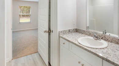 Welcome to the Freeport Plan, a new home floor plan at Sunny on Sunny Hills Golf and Country Club in Florida - for sale on GolfHomes.com, golf home, golf lot