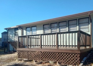 NO LOT RENT, it is a deeded lot, 2 bedrooms 1-1/2 Baths on Tooke on Glen Lakes Country Club in Florida - for sale on GolfHomes.com, golf home, golf lot