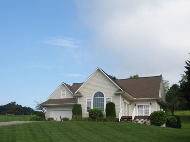 This exceptional home overlooks the 14th hole and beautiful lake on The Clubs of Olde Mill in Virginia - for sale on GolfHomes.com, golf home, golf lot
