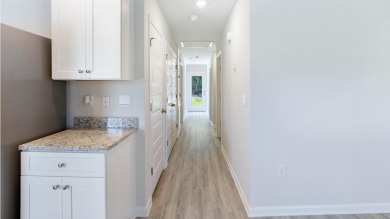 Welcome to the Freeport Plan, a new home floor plan at Sunny on Sunny Hills Golf and Country Club in Florida - for sale on GolfHomes.com, golf home, golf lot