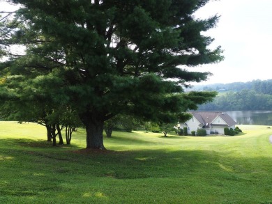This exceptional home overlooks the 14th hole and beautiful lake on The Clubs of Olde Mill in Virginia - for sale on GolfHomes.com, golf home, golf lot