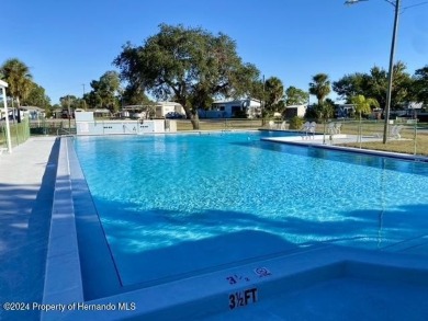 NO LOT RENT, it is a deeded lot, 2 bedrooms 1-1/2 Baths on Tooke on Glen Lakes Country Club in Florida - for sale on GolfHomes.com, golf home, golf lot