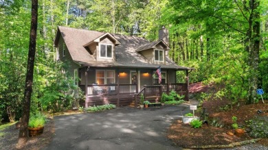 Located in Sapphire Valley, this 3-bedroom, 2.5-bathroom cabin on Sapphire National Golf Club in North Carolina - for sale on GolfHomes.com, golf home, golf lot