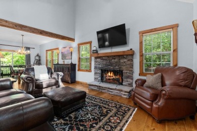Located in Sapphire Valley, this 3-bedroom, 2.5-bathroom cabin on Sapphire National Golf Club in North Carolina - for sale on GolfHomes.com, golf home, golf lot