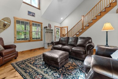 Located in Sapphire Valley, this 3-bedroom, 2.5-bathroom cabin on Sapphire National Golf Club in North Carolina - for sale on GolfHomes.com, golf home, golf lot