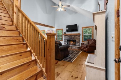 Located in Sapphire Valley, this 3-bedroom, 2.5-bathroom cabin on Sapphire National Golf Club in North Carolina - for sale on GolfHomes.com, golf home, golf lot