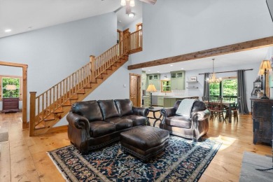 Located in Sapphire Valley, this 3-bedroom, 2.5-bathroom cabin on Sapphire National Golf Club in North Carolina - for sale on GolfHomes.com, golf home, golf lot