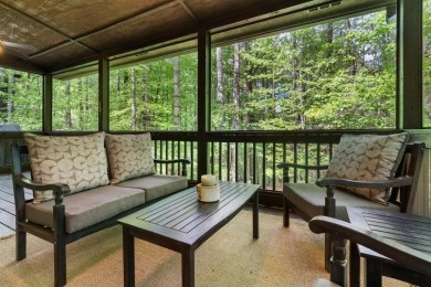 Located in Sapphire Valley, this 3-bedroom, 2.5-bathroom cabin on Sapphire National Golf Club in North Carolina - for sale on GolfHomes.com, golf home, golf lot