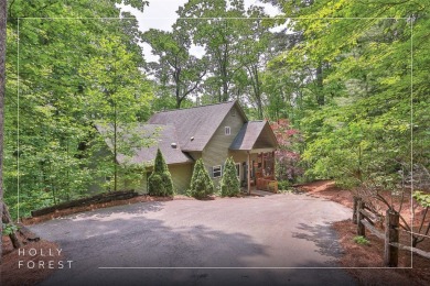 Immersed in tranquility, this three-bedroom, three-bathroom on Sapphire National Golf Club in North Carolina - for sale on GolfHomes.com, golf home, golf lot