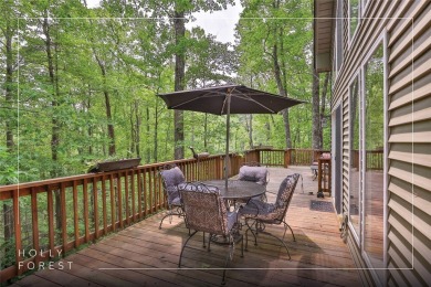 Immersed in tranquility, this three-bedroom, three-bathroom on Sapphire National Golf Club in North Carolina - for sale on GolfHomes.com, golf home, golf lot