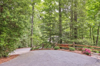 Immersed in tranquility, this three-bedroom, three-bathroom on Sapphire National Golf Club in North Carolina - for sale on GolfHomes.com, golf home, golf lot