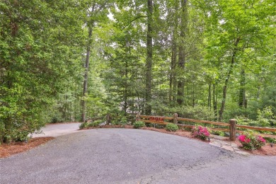 Immersed in tranquility, this three-bedroom, three-bathroom on Sapphire National Golf Club in North Carolina - for sale on GolfHomes.com, golf home, golf lot