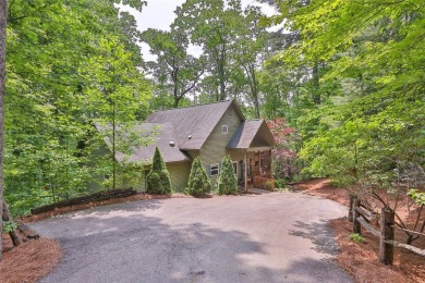 Immersed in tranquility, this three-bedroom, three-bathroom on Sapphire National Golf Club in North Carolina - for sale on GolfHomes.com, golf home, golf lot