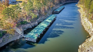 Breathtaking Modern Lakefront Retreat with Boat Slip Welcome to on Indian Hills Country Club in Arkansas - for sale on GolfHomes.com, golf home, golf lot