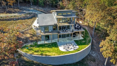 Breathtaking Modern Lakefront Retreat with Boat Slip Welcome to on Indian Hills Country Club in Arkansas - for sale on GolfHomes.com, golf home, golf lot
