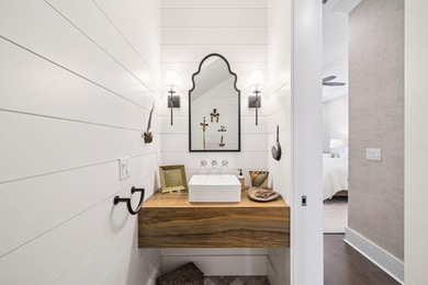 Tucked away on a quiet cul-de-sac, surrounded by magnolias and on Santa Rosa Golf and Beach Club in Florida - for sale on GolfHomes.com, golf home, golf lot