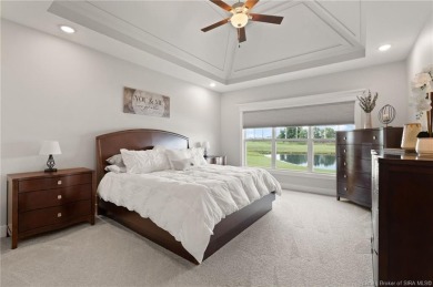 Nestled on a breathtaking 0.43-acre estate lot in the on Champions Pointe Golf Course in Indiana - for sale on GolfHomes.com, golf home, golf lot