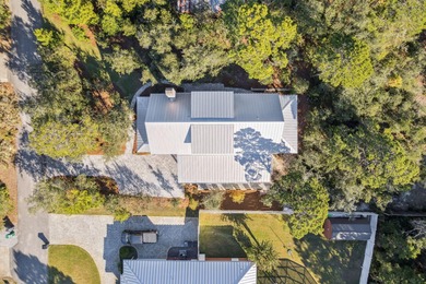 Tucked away on a quiet cul-de-sac, surrounded by magnolias and on Santa Rosa Golf and Beach Club in Florida - for sale on GolfHomes.com, golf home, golf lot