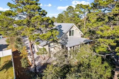 Tucked away on a quiet cul-de-sac, surrounded by magnolias and on Santa Rosa Golf and Beach Club in Florida - for sale on GolfHomes.com, golf home, golf lot