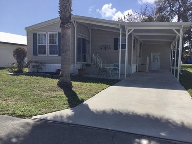 Meticulously maintained home in the much sought after Spanish on Spanish Lakes I in Florida - for sale on GolfHomes.com, golf home, golf lot