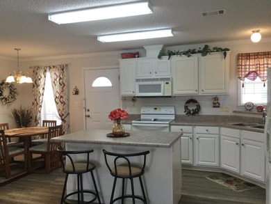 Meticulously maintained home in the much sought after Spanish on Spanish Lakes I in Florida - for sale on GolfHomes.com, golf home, golf lot